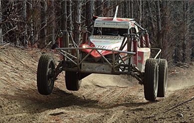 Alan Butler in the deep, rough sand tracks of Woodhill Forest. 